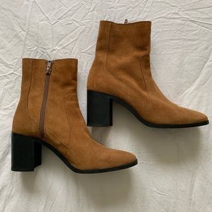 Never worn, brown heeled boots. Size 37 US
